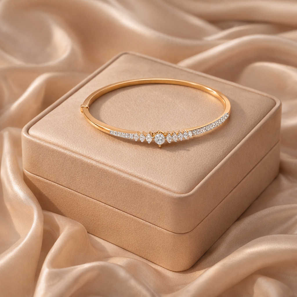 Gold bracelet with diamonds on a matching jewelry box, both on a beige fabric background