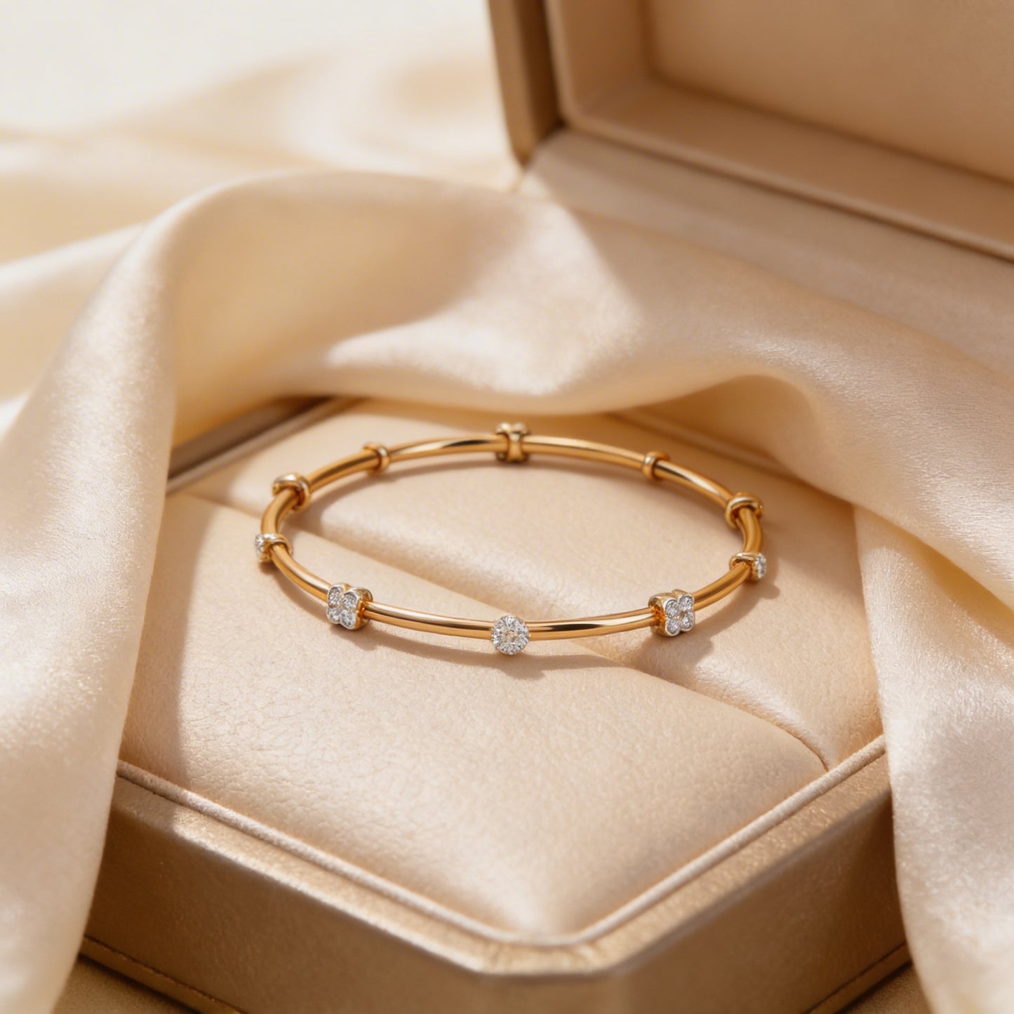 Gold bracelet with diamond accents in a jewelry box on beige fabric