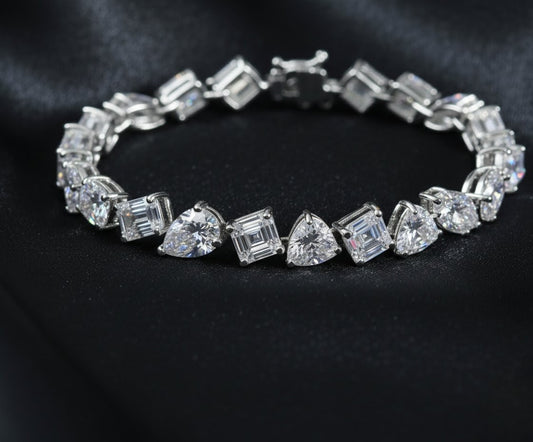 Diamond bracelet with various cut diamonds on a black background