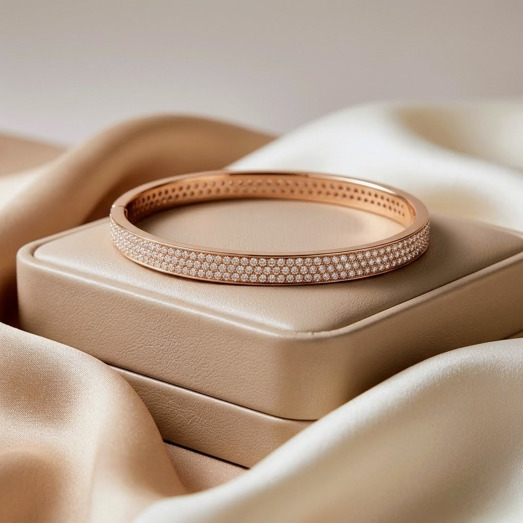 Rose gold bracelet on a beige fabric background