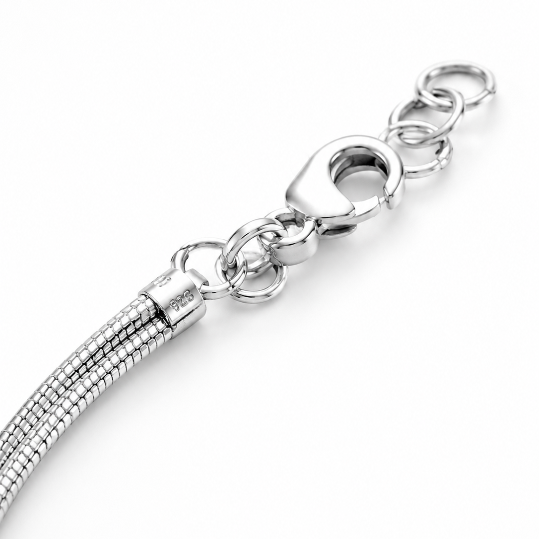 Silver bracelet with a clasp on a white background
