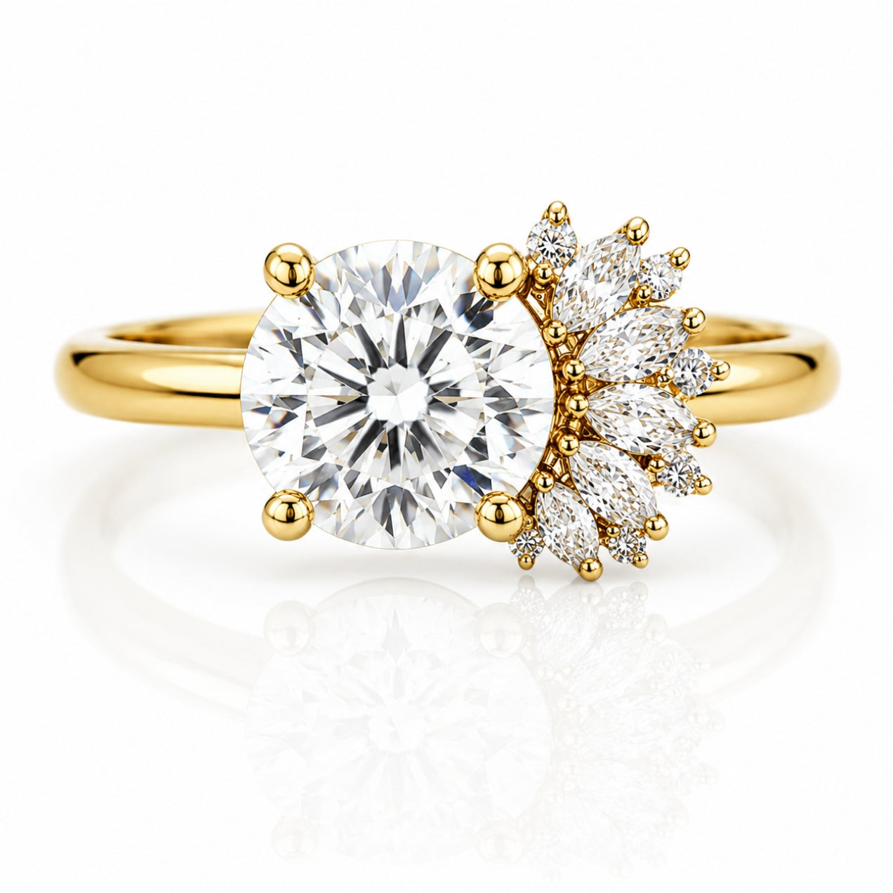 A yellow gold ring featuring a large round brilliant-cut center stone and a marquise-cut cluster of accent stones on the right side, set on a polished gold band against a white background with a soft reflection.